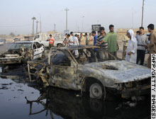 Destroyed cars after US attack